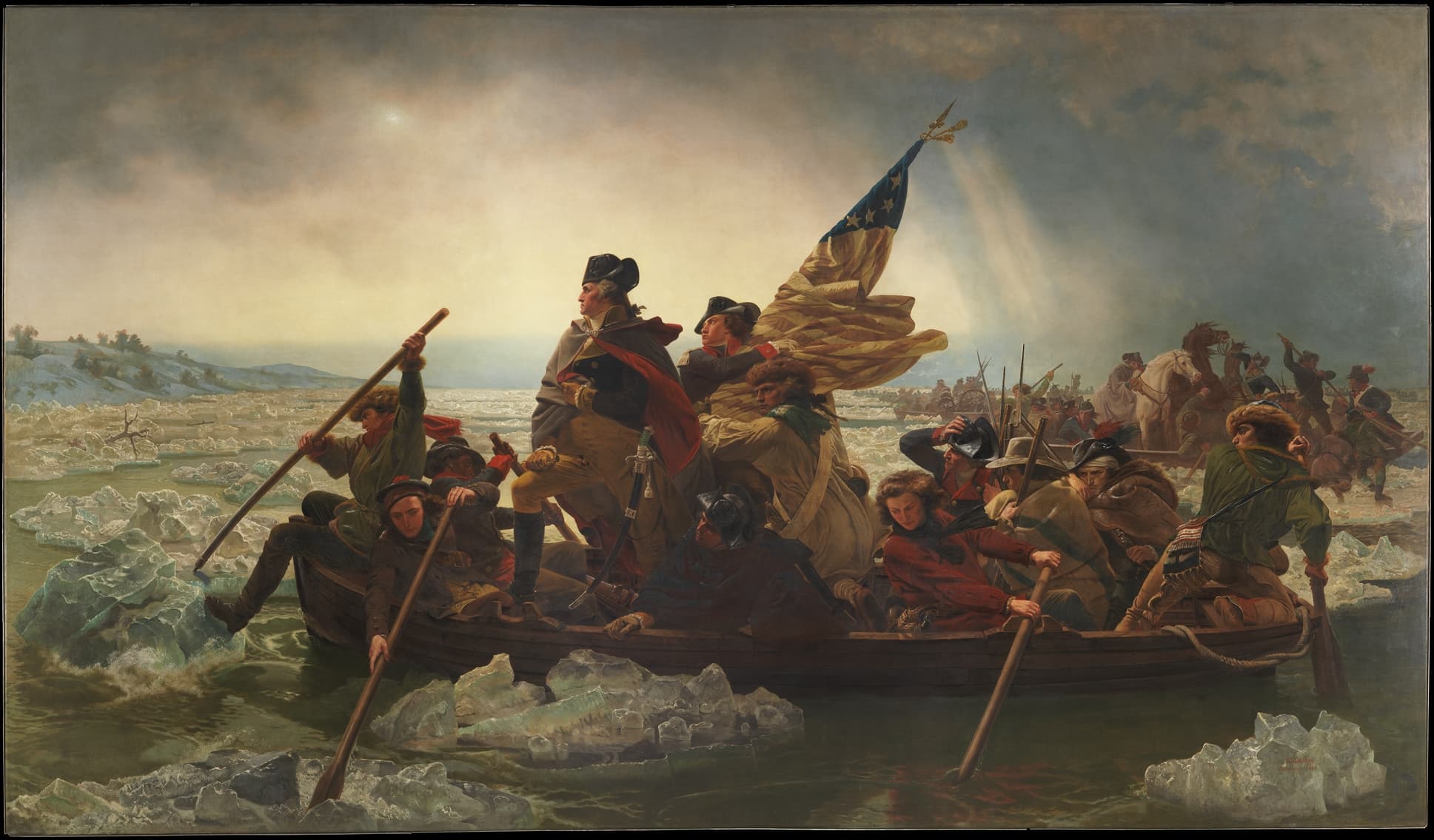 A painting depicting General George Washington leading his troops across the Delaware River during the American Revolutionary War. Washington is  at the bow of a wooden boat, wrapped in a dark blue cloak, with the American flag held high. The soldiers, bundled in winter coats, row the boat through icy waters under a dim, cloudy sky.
